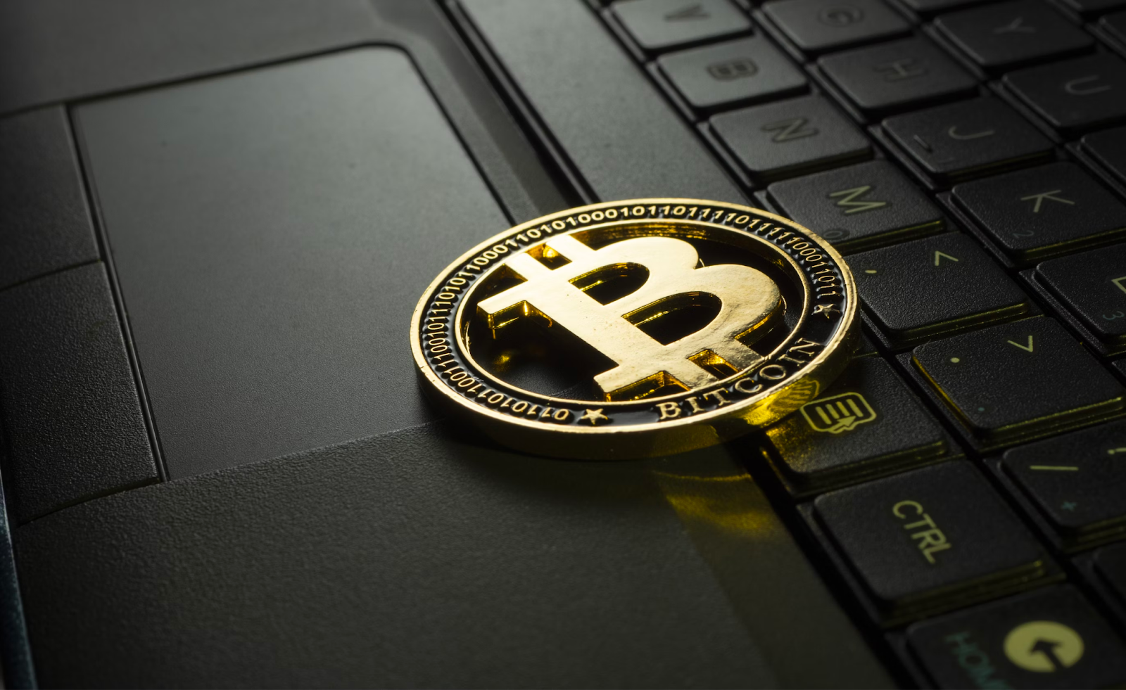 A Bitcoin on a laptop